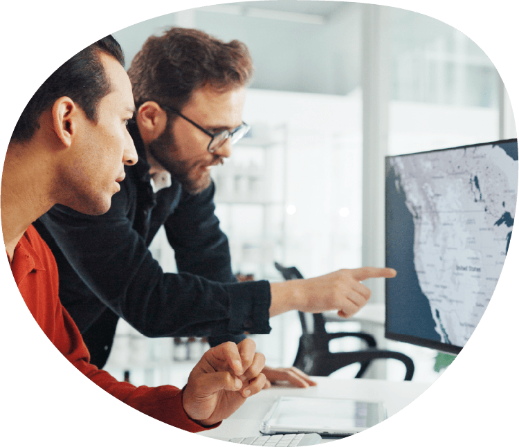 two guys looking at the computer screen