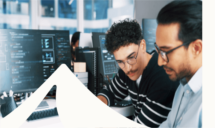 two men and computer with code