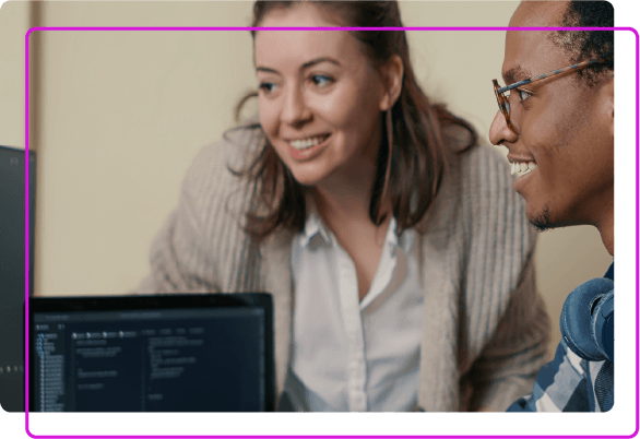 two people and part of laptop screen